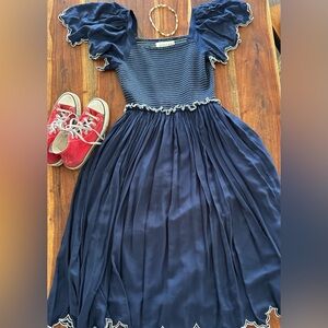 Jessa Kae Helen smocked blue dress with smocked bodice and scalloped sleeves l